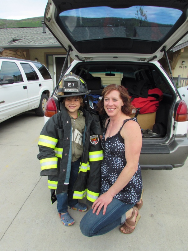 Finley got to try on fire fighter Jenny's equipment!